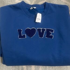 J Crew “Love” graphic sweatshirt. Blue/Size Large. Fits Medium. NWT